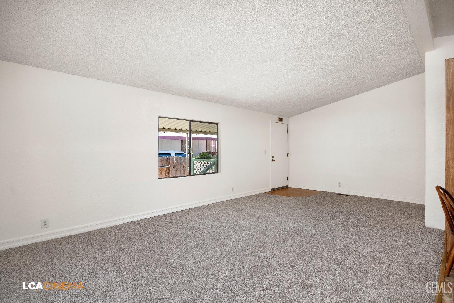 Undisclosed Address Bakersfield, CA 93307 - Photo 5 of 20 a view of an empty room with a window