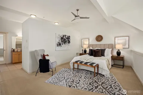 a bedroom with bed and window