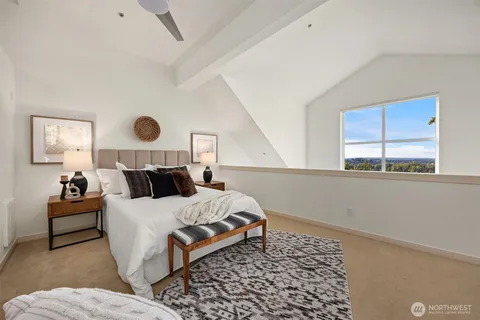 a bedroom with a bed and window