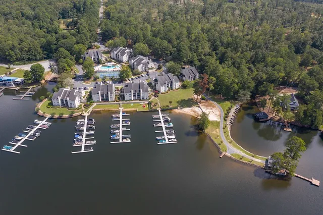 an aerial view of a house with swimming pool outdoor seating and yard