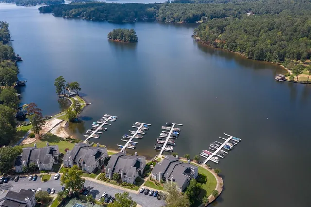 an aerial view of a house yard swimming pool and outdoor seating