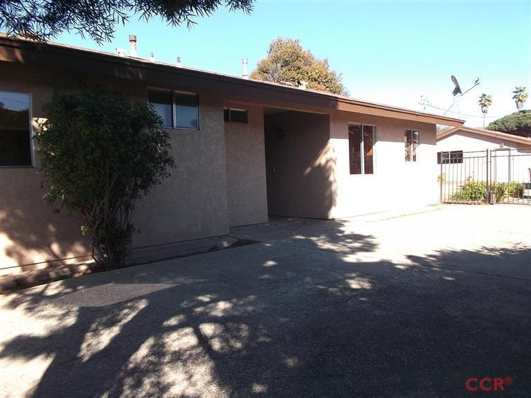 404 North A Street Lompoc, CA 93436 - Photo 1 of 15 a view of house with a yard