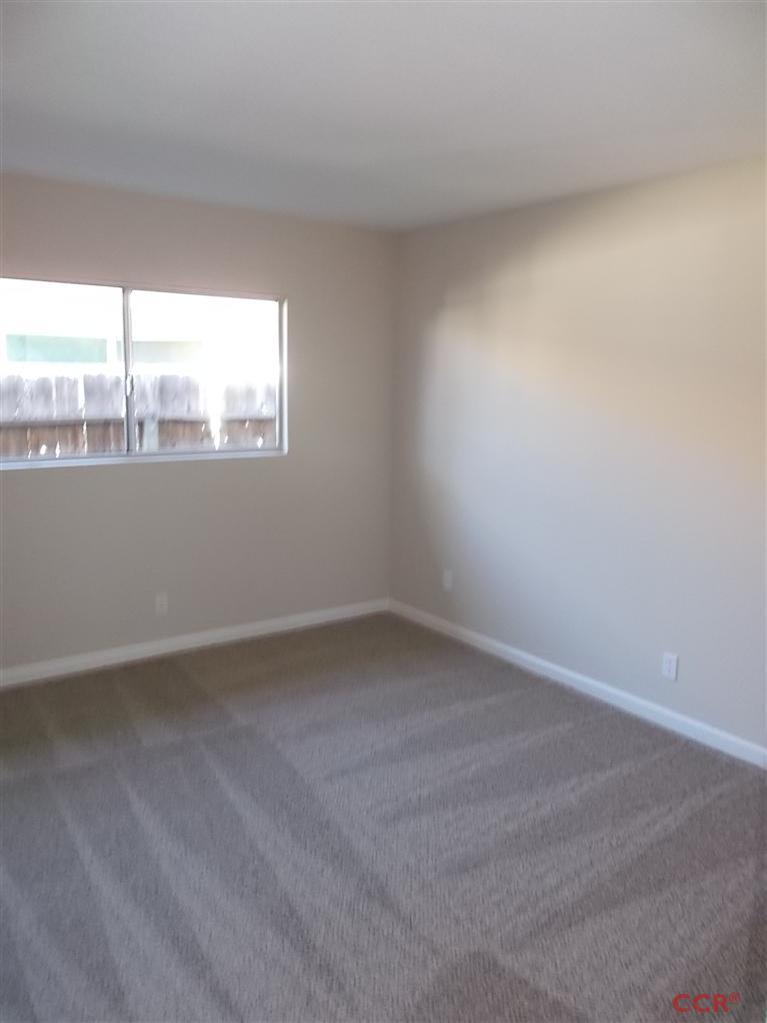 404 North A Street Lompoc, CA 93436 - Photo 11 of 15 a view of an empty room with a window