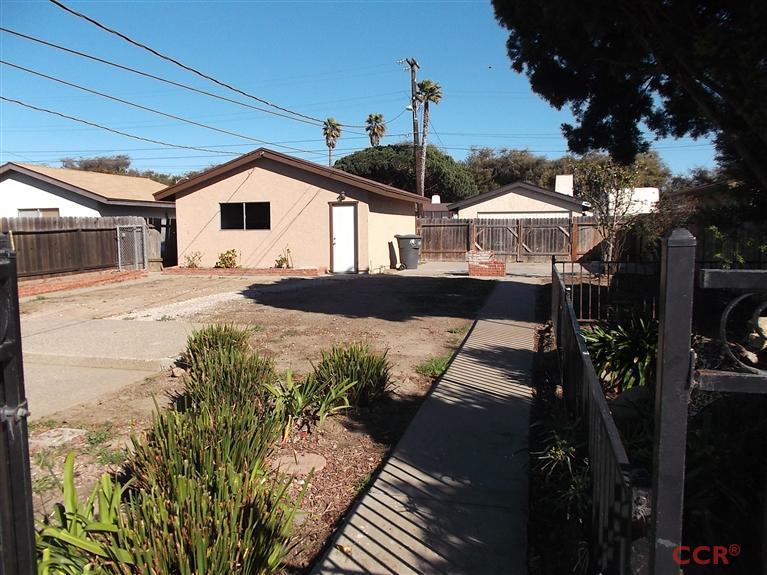 404 North A Street Lompoc, CA 93436 - Photo 13 of 15 a front view of a house with a yard