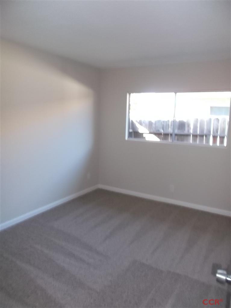 404 North A Street Lompoc, CA 93436 - Photo 8 of 15 a view of an empty room and window
