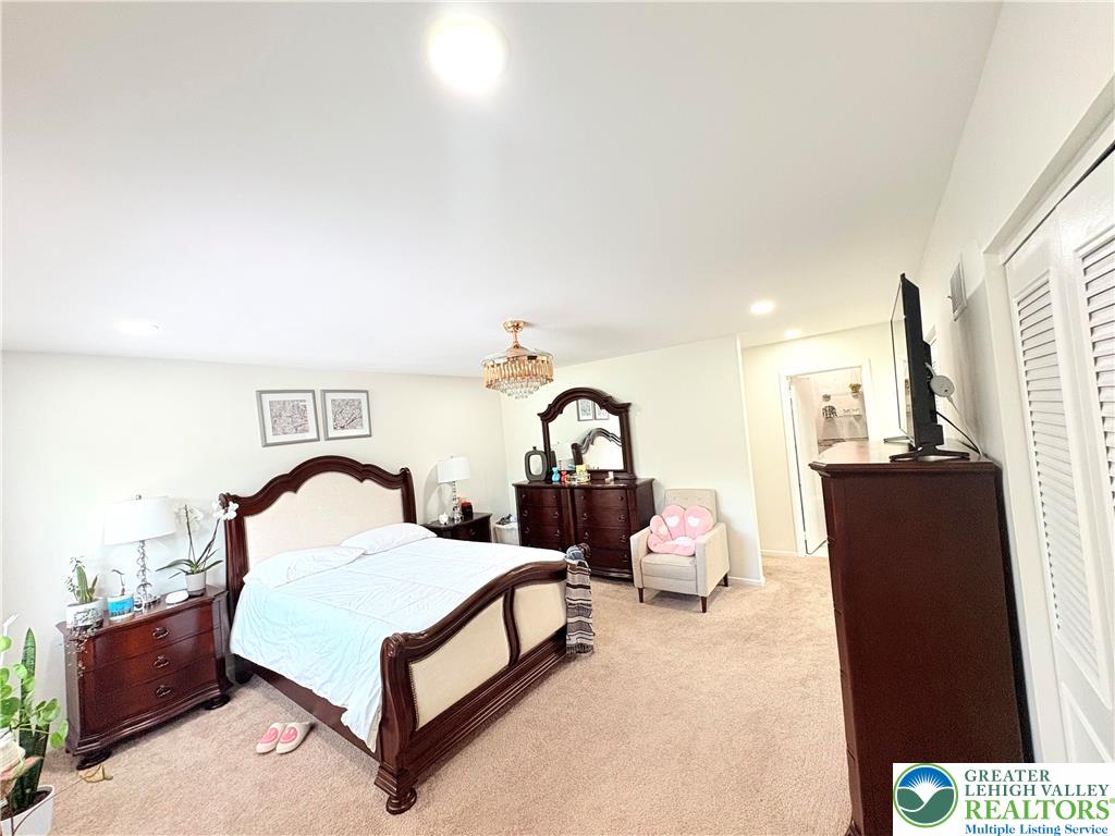 1558 Creekside Road Whitehall, PA 18052 - Photo 33 of 52 a bedroom with a bed and a large window