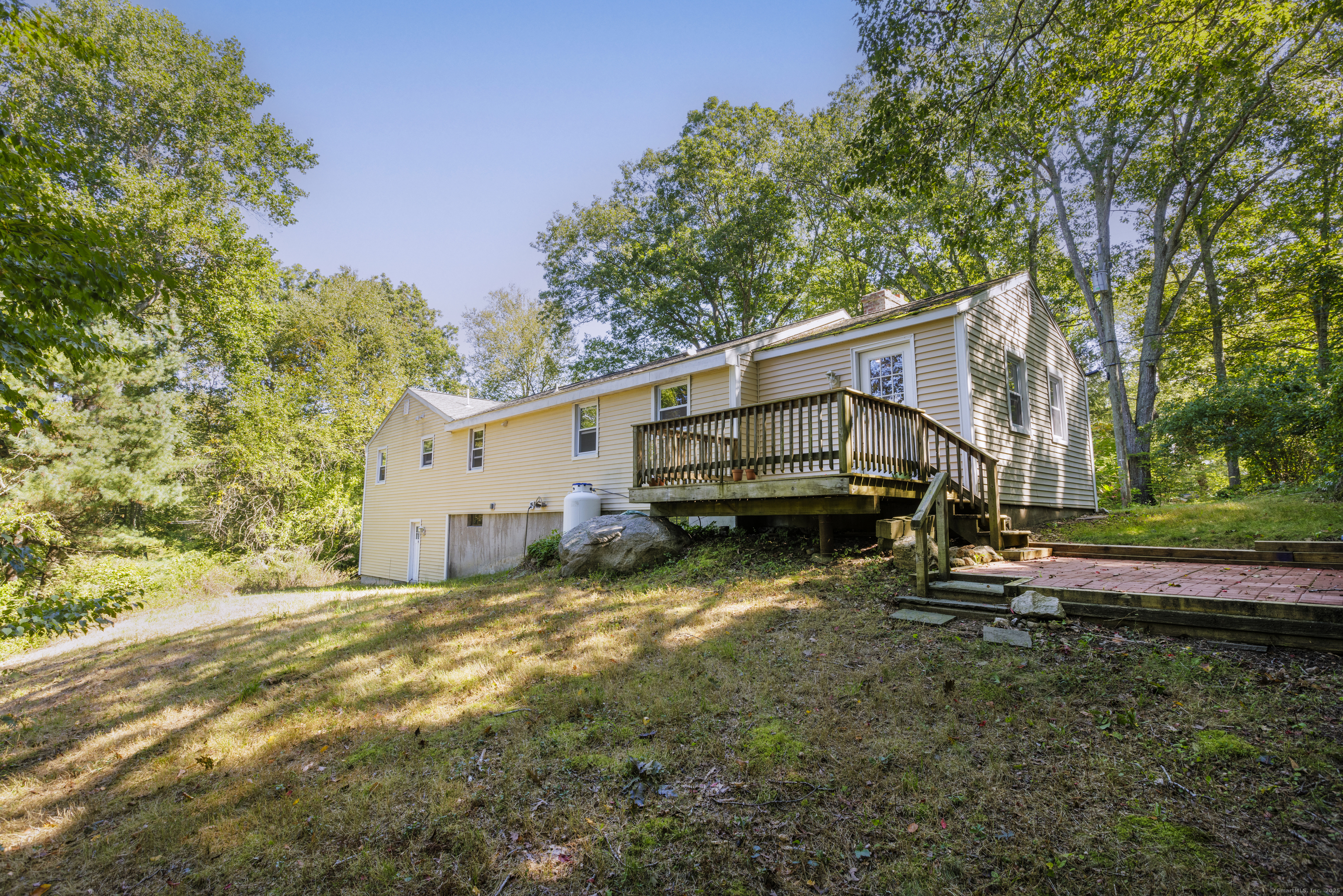 239 A Rockledge Road Lyme, CT 06371 - Photo 25 of 30 a view of a house with a yard