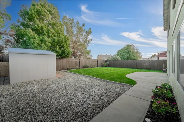 a view of a yard with a house