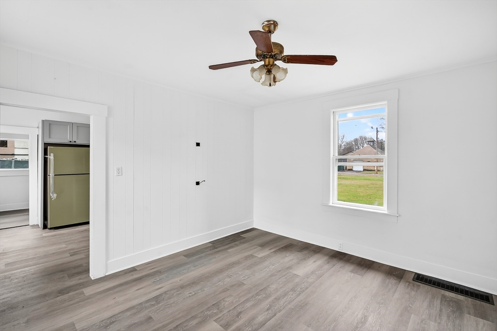 150 East Main Street Orange, MA 01364 - Photo 12 of 41 a view of empty room with wooden floor and fan