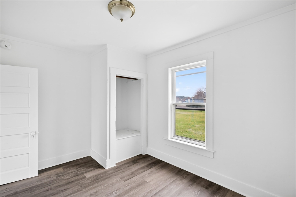 150 East Main Street Orange, MA 01364 - Photo 17 of 41 a view of hallway with window and wooden floor
