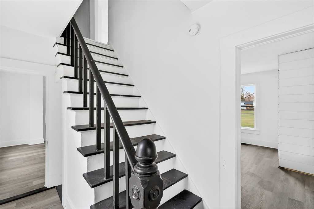150 East Main Street Orange, MA 01364 - Photo 21 of 41 a view of entryway with wooden floor and stairs