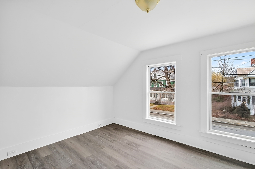 150 East Main Street Orange, MA 01364 - Photo 25 of 41 a view of an empty room with a window and wooden floor
