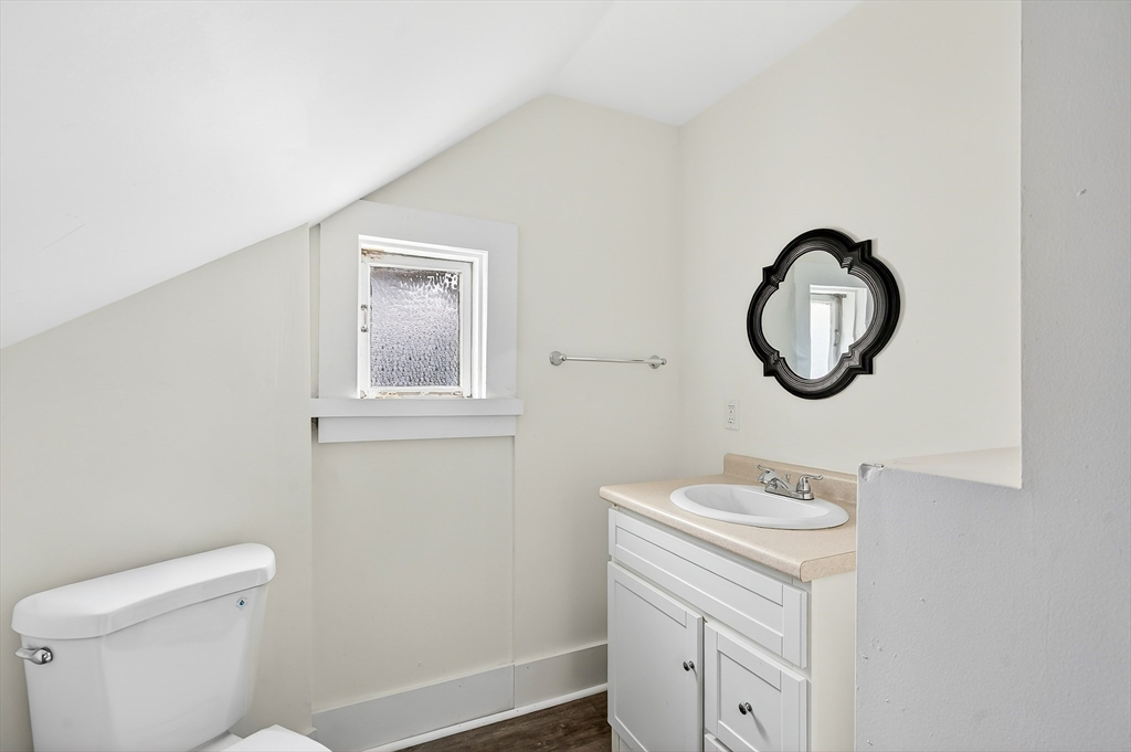 150 East Main Street Orange, MA 01364 - Photo 27 of 41 a bathroom with a toilet a sink and a mirror