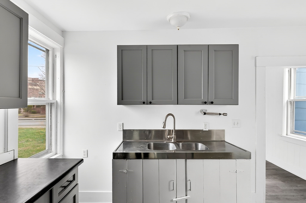 150 East Main Street Orange, MA 01364 - Photo 5 of 41 a kitchen with a sink cabinets and window