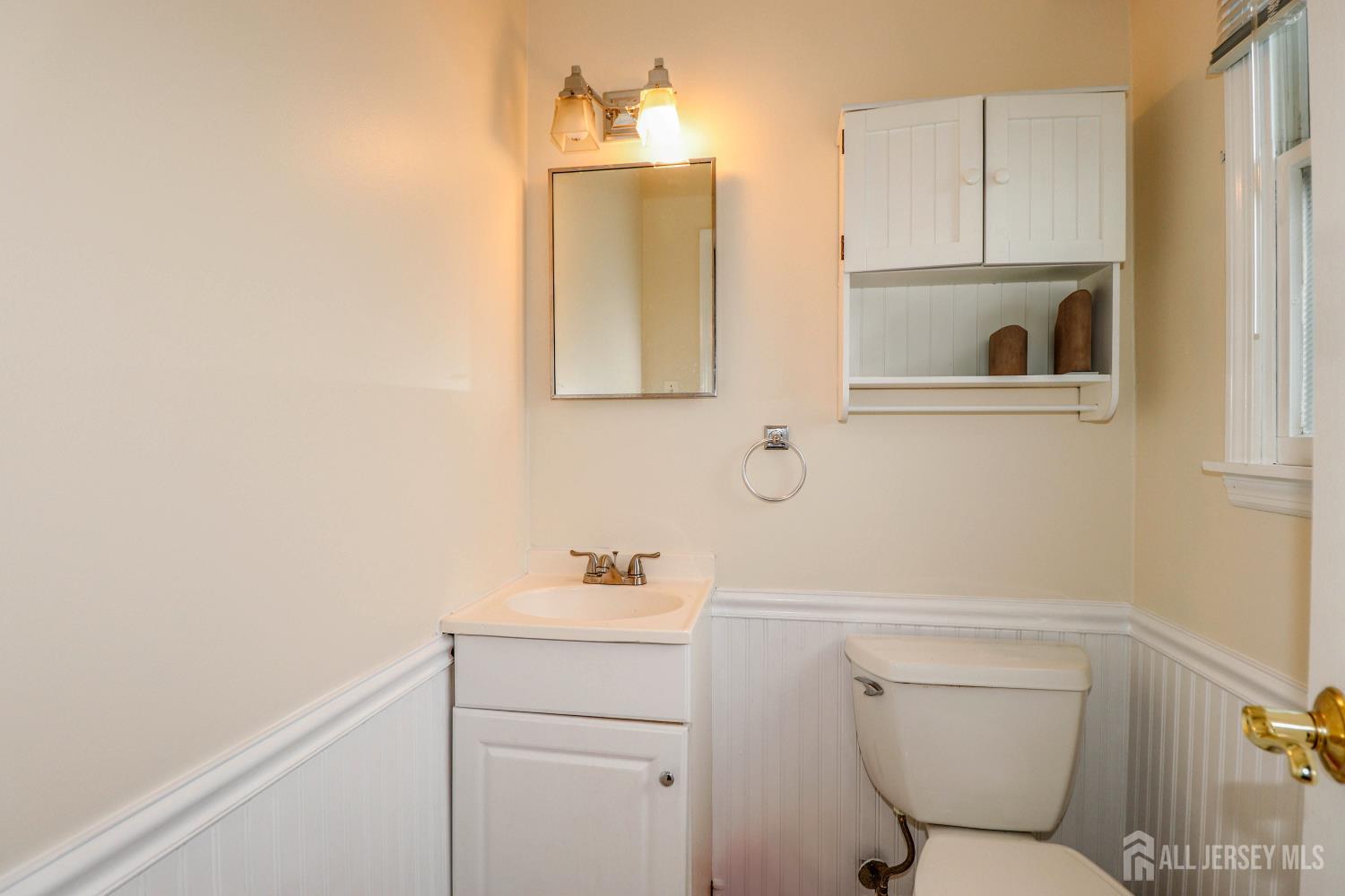 5 Timothy Court Edison, NJ 08837 - Photo 27 of 32 a bathroom with a toilet sink and mirror