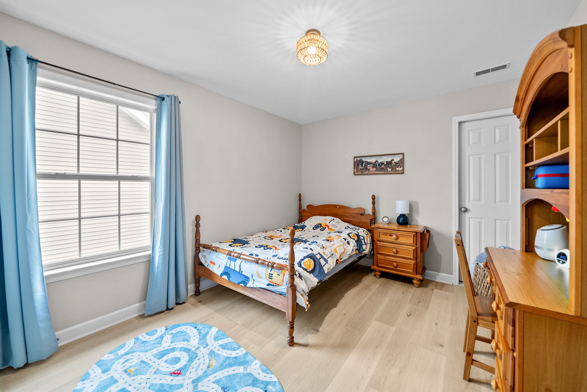 1161 Cynthia Lane Spring Hill, TN 37174 - Photo 22 of 42 a bed sitting in a bedroom next to a window