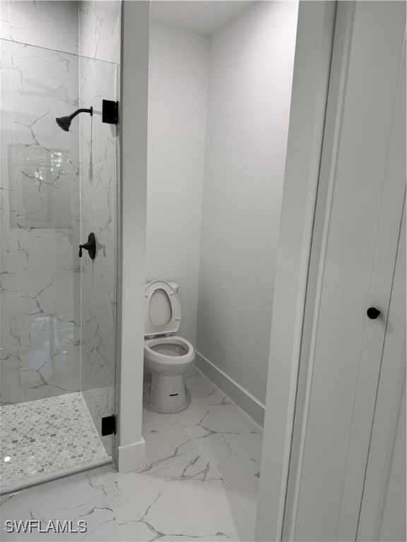3701 East 3rd Street Lehigh Acres, FL 33936 - Photo 11 of 19 a bathroom with a toilet and shower