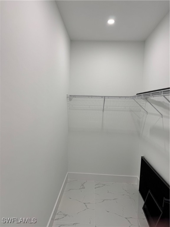 3701 East 3rd Street Lehigh Acres, FL 33936 - Photo 12 of 19 a view of a room with racks on the wall