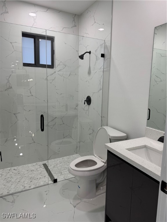 3701 East 3rd Street Lehigh Acres, FL 33936 - Photo 15 of 19 a bathroom with a sink a toilet and shower