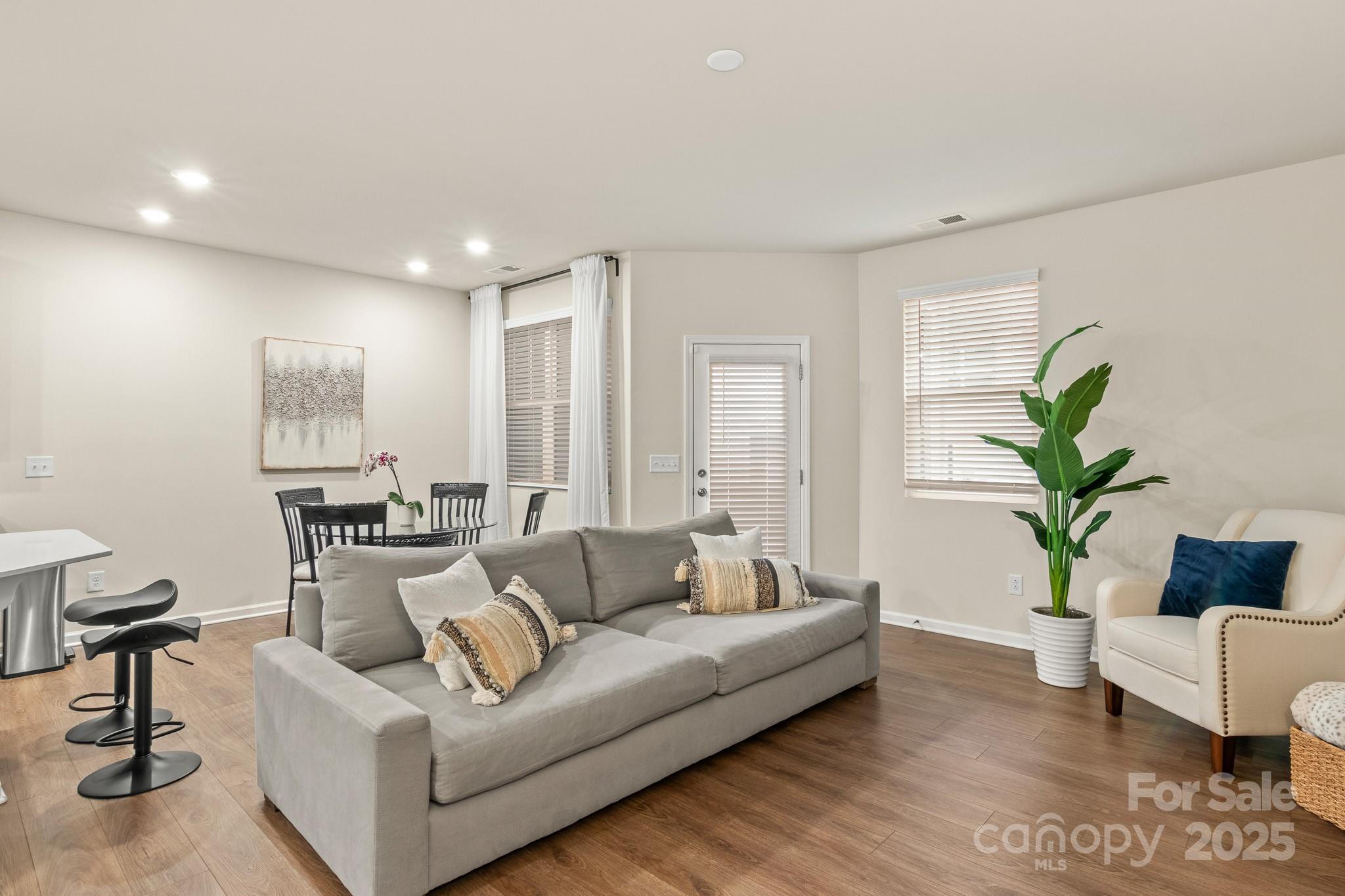 804 Gable Oak Lane Fort Mill, SC 29708 - Photo 13 of 26 a living room with furniture and a potted plant