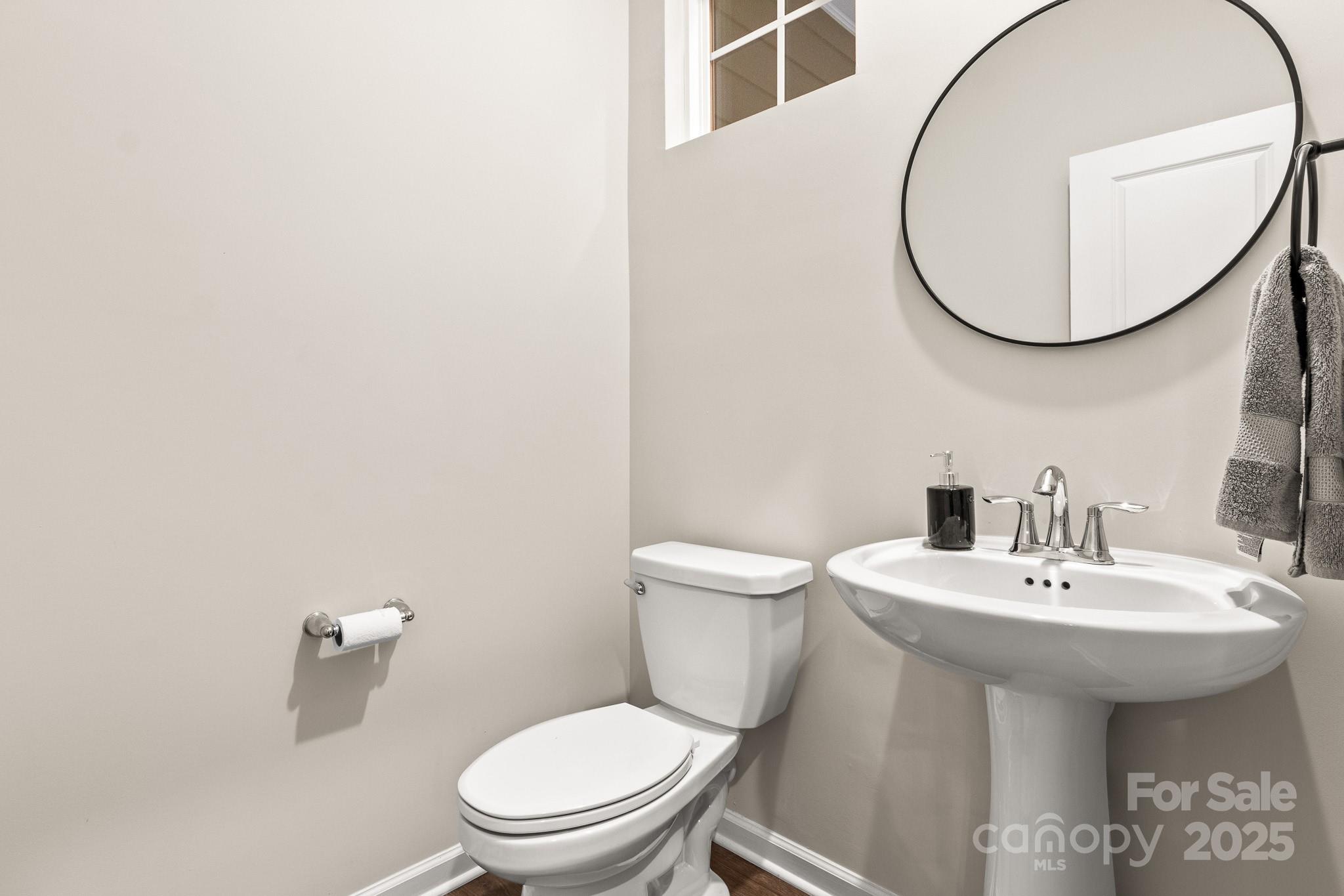 804 Gable Oak Lane Fort Mill, SC 29708 - Photo 15 of 26 a bathroom with a sink a mirror and a toilet