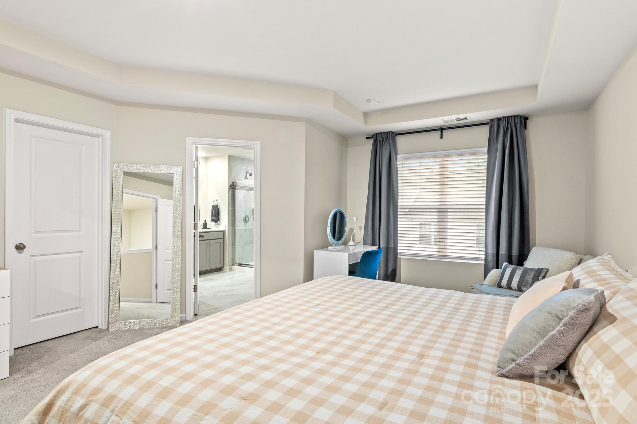 804 Gable Oak Lane Fort Mill, SC 29708 - Photo 16 of 26 a bedroom with a large bed and a large window