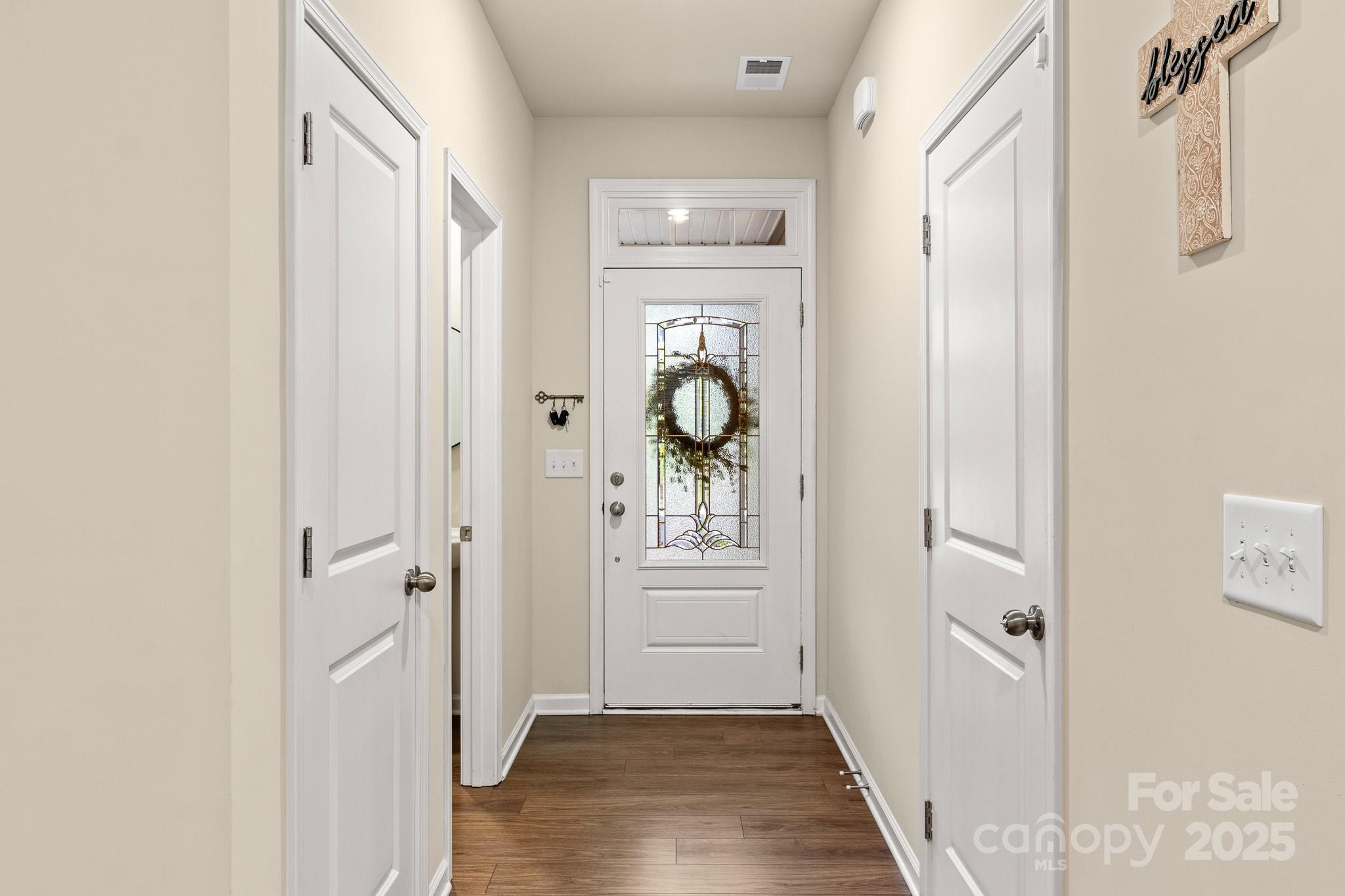 804 Gable Oak Lane Fort Mill, SC 29708 - Photo 5 of 26 a view of a hallway view with wooden floor and staircase