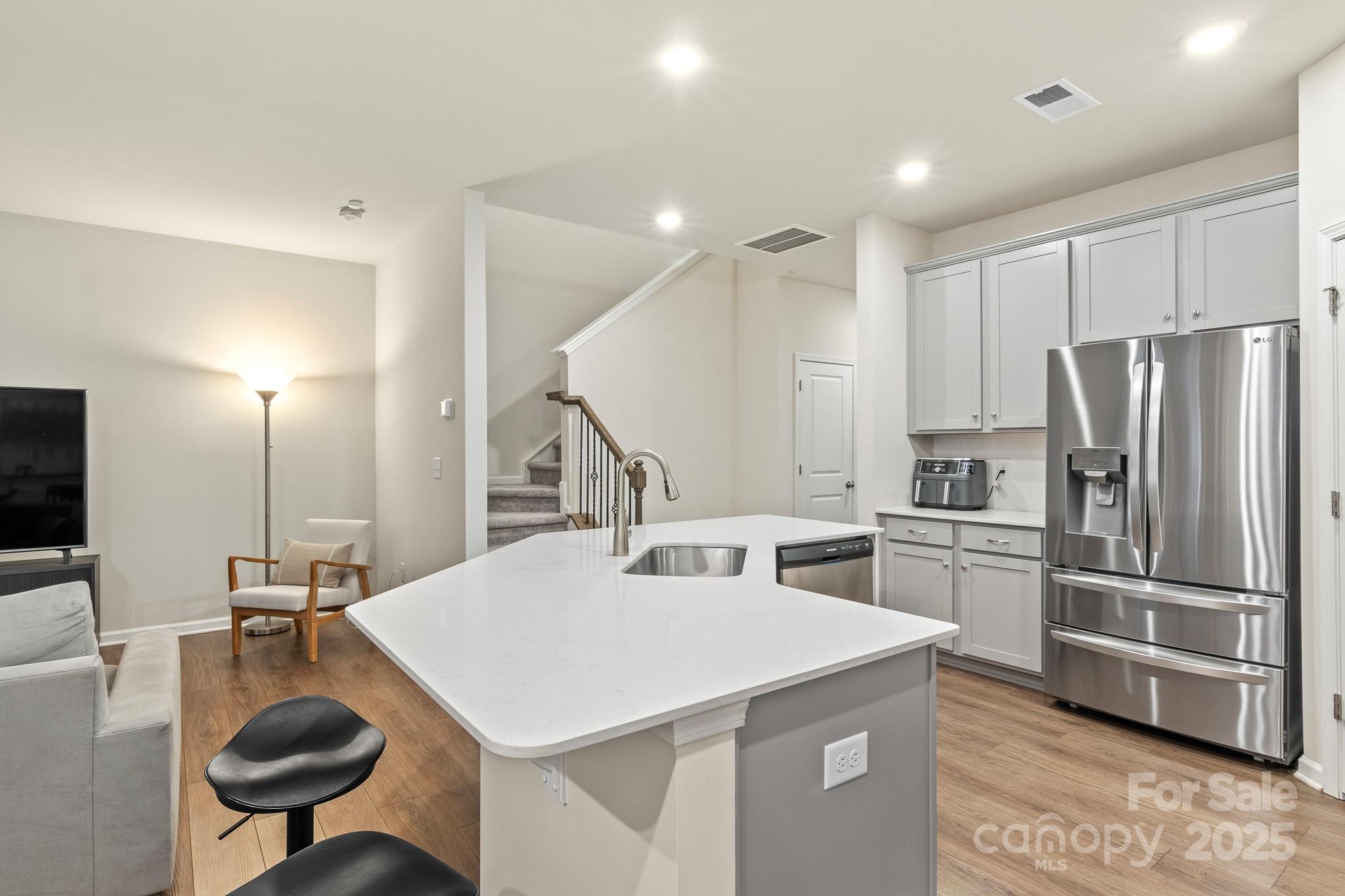 804 Gable Oak Lane Fort Mill, SC 29708 - Photo 8 of 26 a kitchen with a refrigerator a sink and a stove