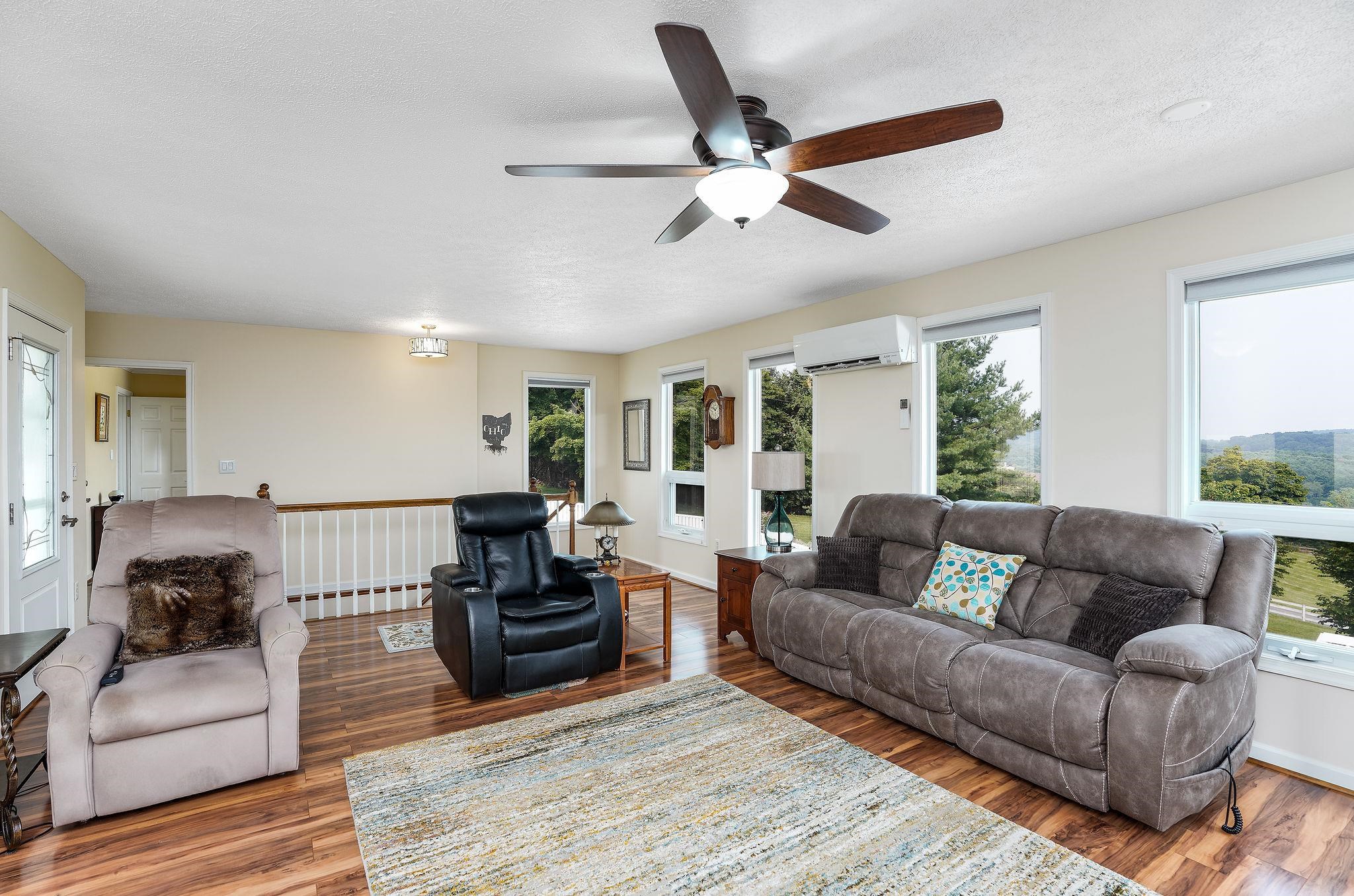 400 Quick's Mill Road Verona, VA 24482 - Photo 12 of 75 a living room with furniture and a wooden floor
