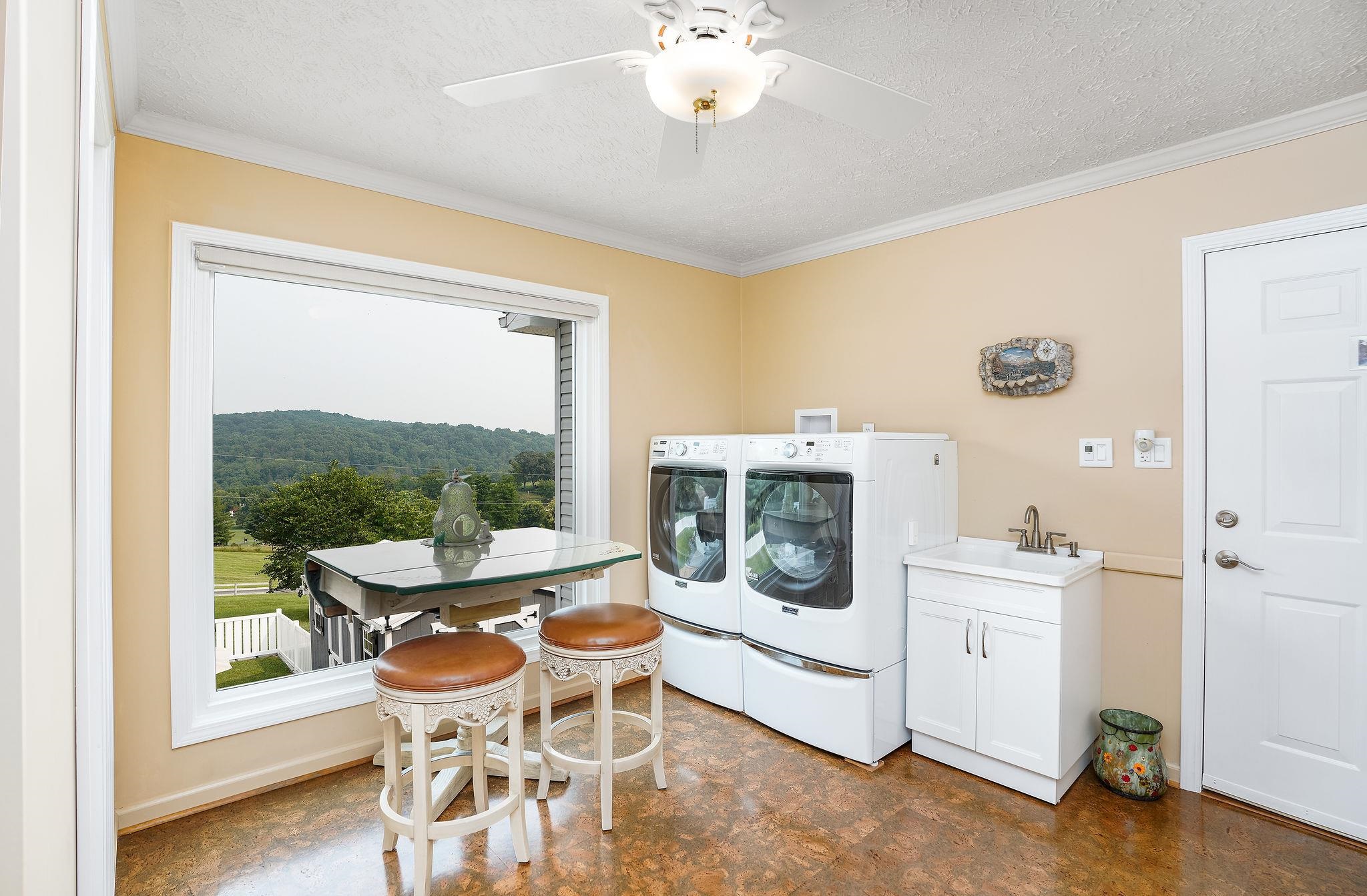 400 Quick's Mill Road Verona, VA 24482 - Photo 14 of 75 a view of a dining room with furniture a chandelier and wooden floor