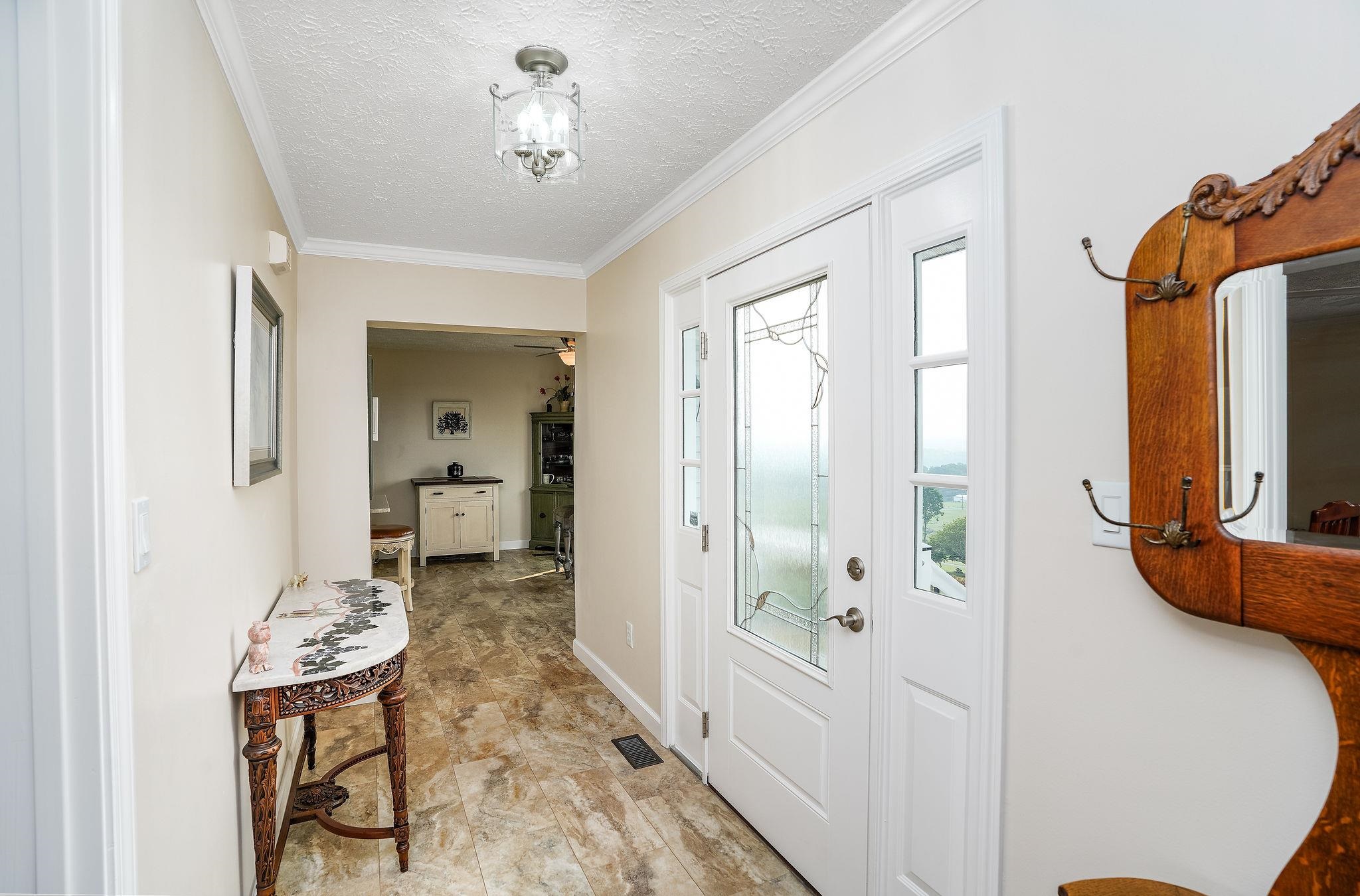 400 Quick's Mill Road Verona, VA 24482 - Photo 27 of 75 a view of a hallway to a livingroom with furniture