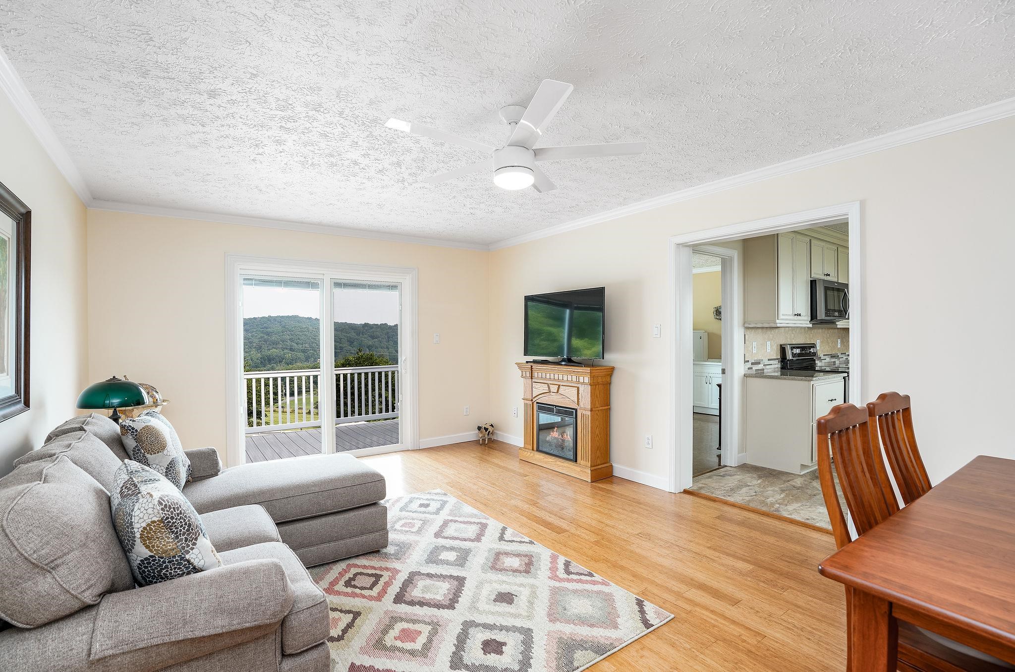 400 Quick's Mill Road Verona, VA 24482 - Photo 29 of 75 a living room with furniture and a floor to ceiling window