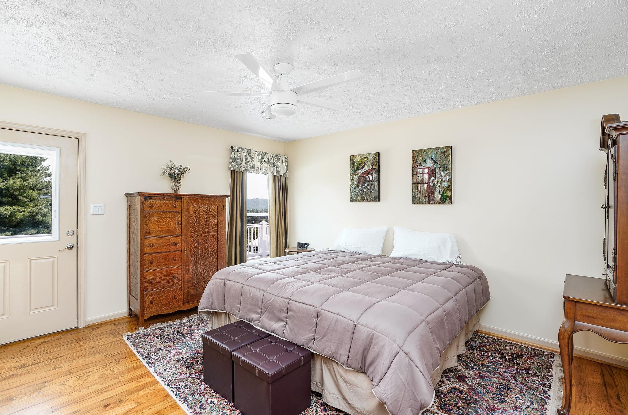 400 Quick's Mill Road Verona, VA 24482 - Photo 31 of 75 a spacious bedroom with a bed a dresser and a window