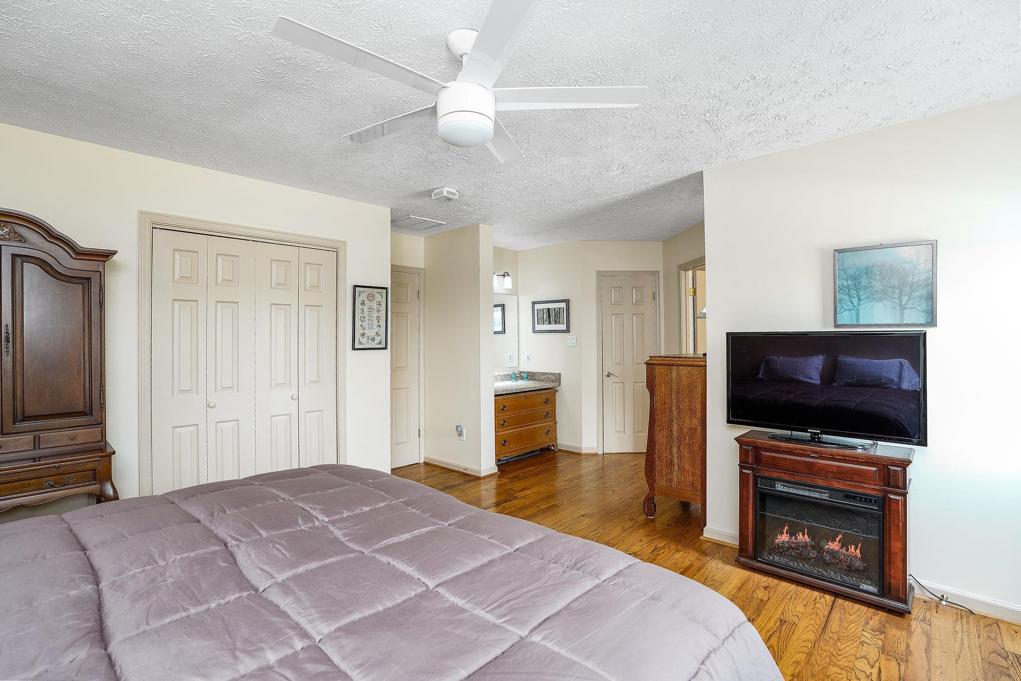 400 Quick's Mill Road Verona, VA 24482 - Photo 32 of 75 a bedroom with a bed and a flat screen tv