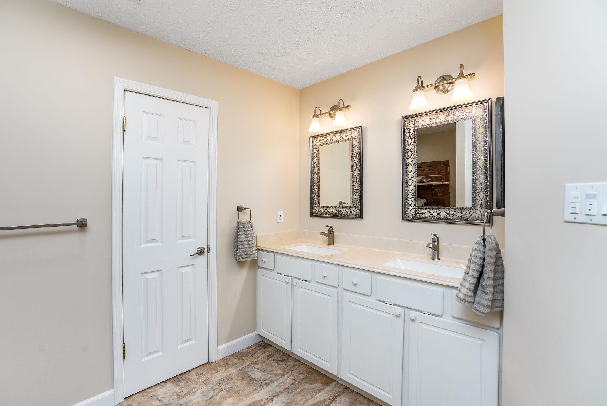400 Quick's Mill Road Verona, VA 24482 - Photo 35 of 75 a bathroom with a sink and a mirror