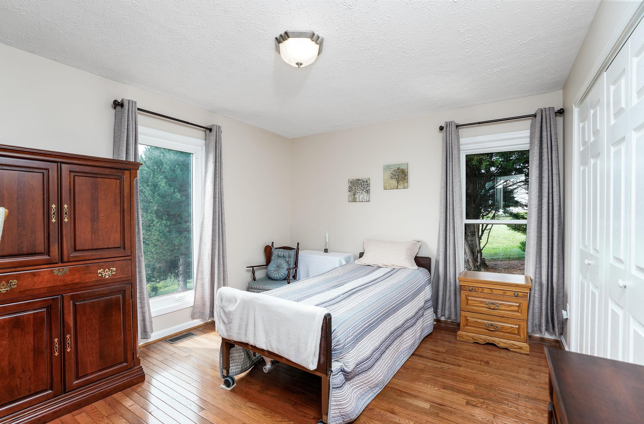 400 Quick's Mill Road Verona, VA 24482 - Photo 40 of 75 a bed room with a bed and a window