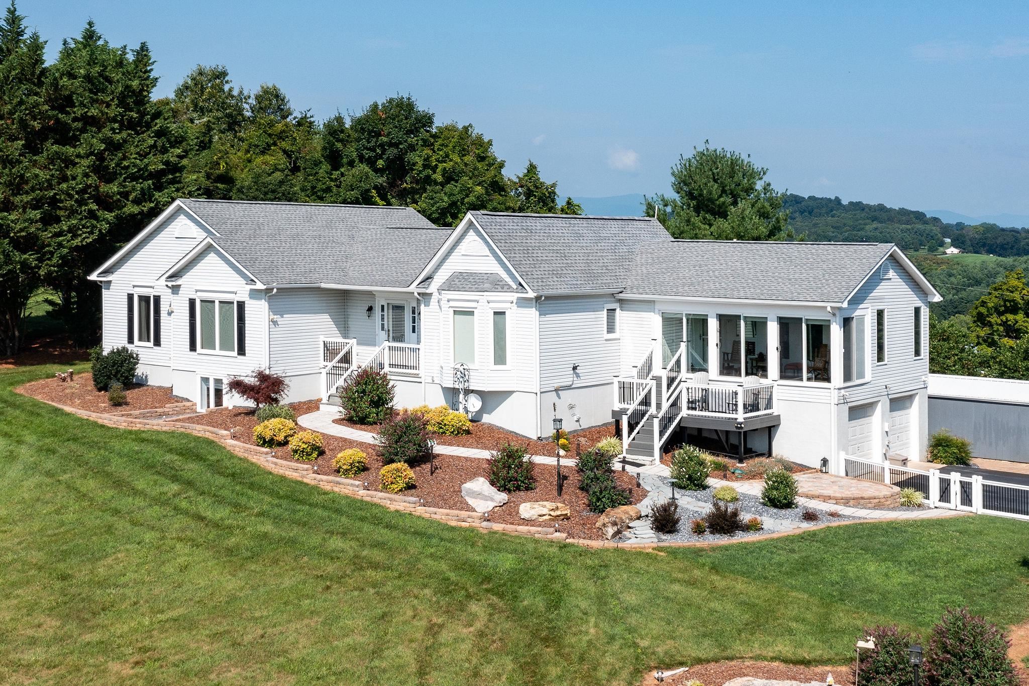 400 Quick's Mill Road Verona, VA 24482 - Photo 4 of 75 a front view of a house with a garden and trees