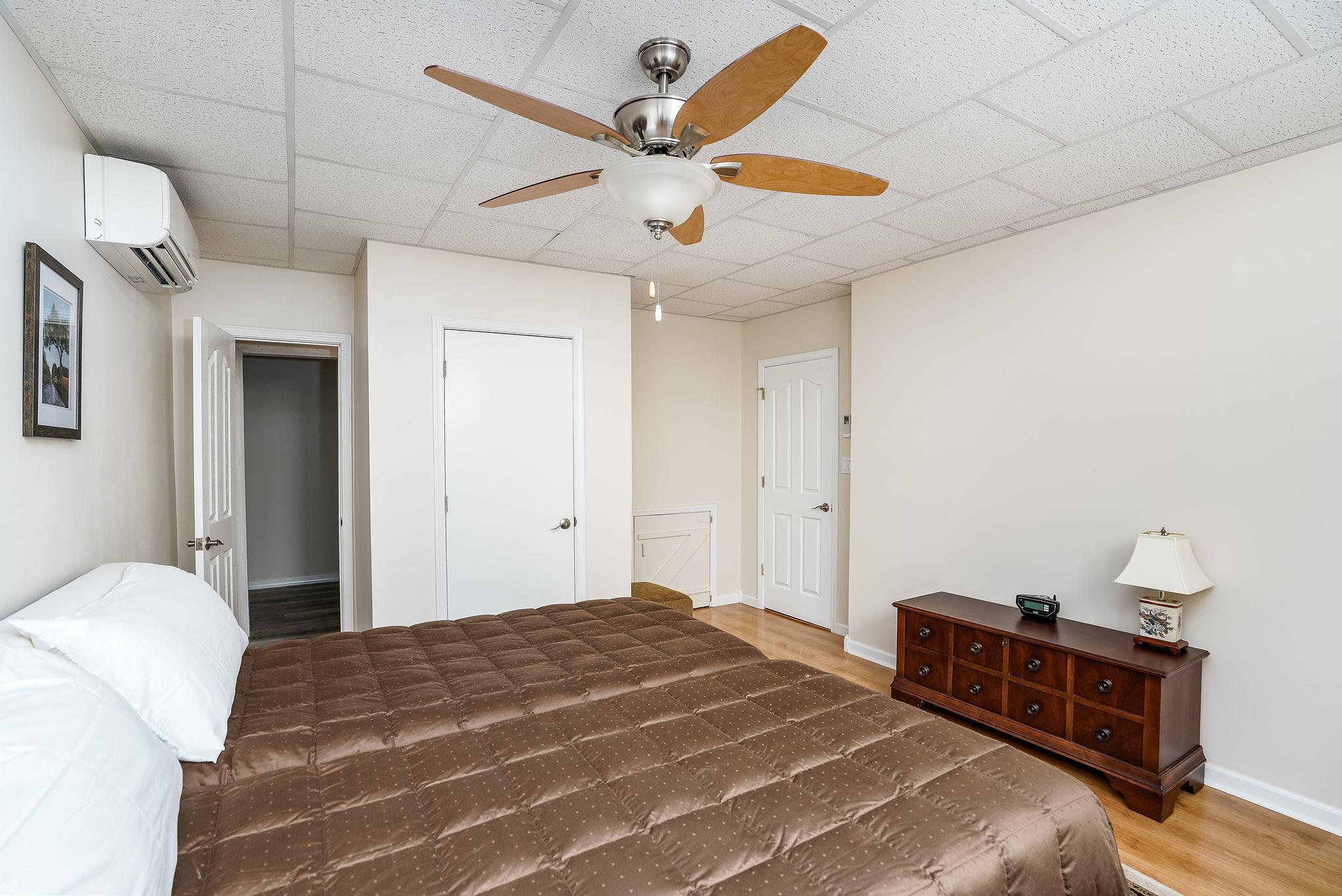 400 Quick's Mill Road Verona, VA 24482 - Photo 50 of 75 a bedroom with a bed dresser and a window