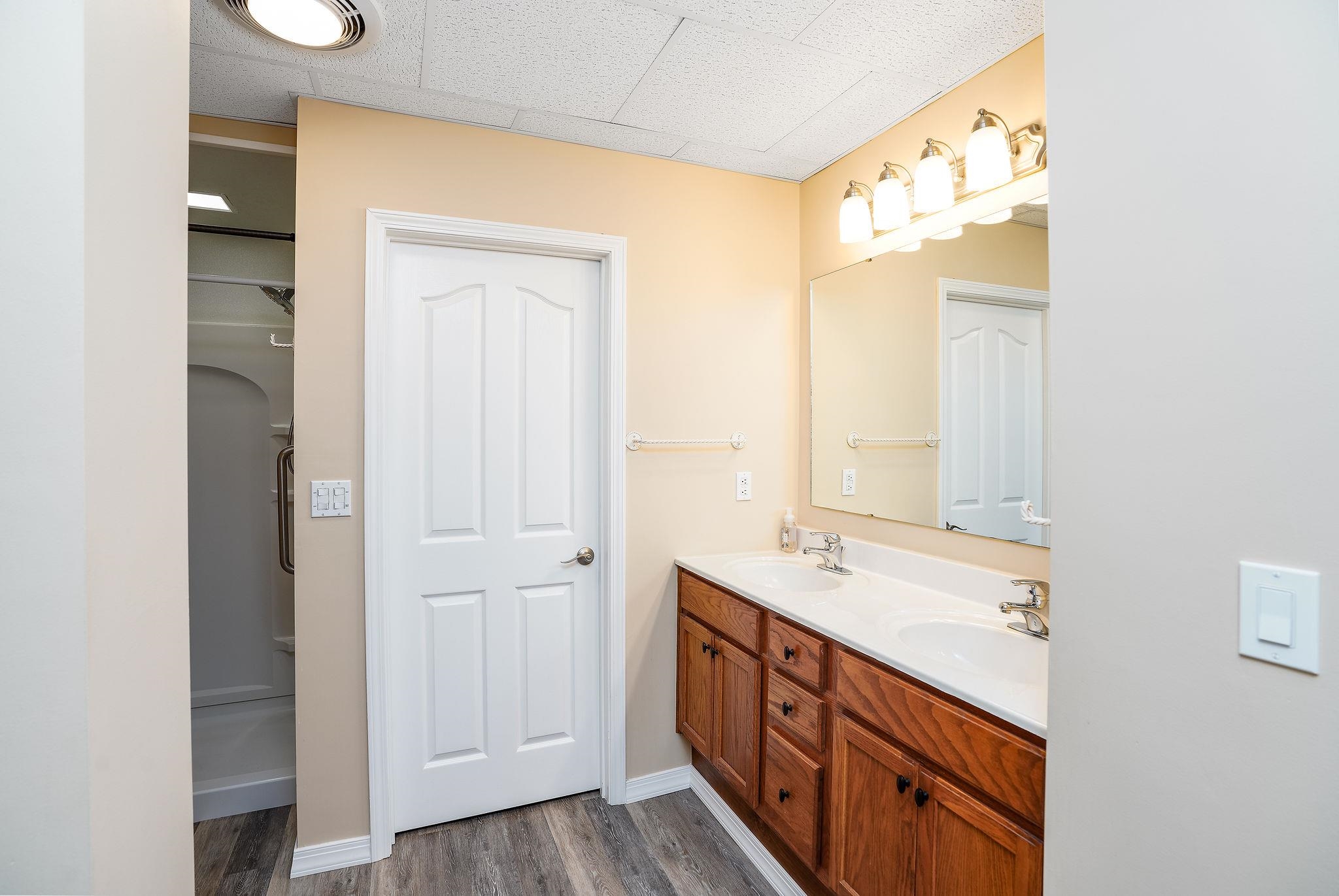 400 Quick's Mill Road Verona, VA 24482 - Photo 51 of 75 a bathroom with a double vanity sink and a mirror