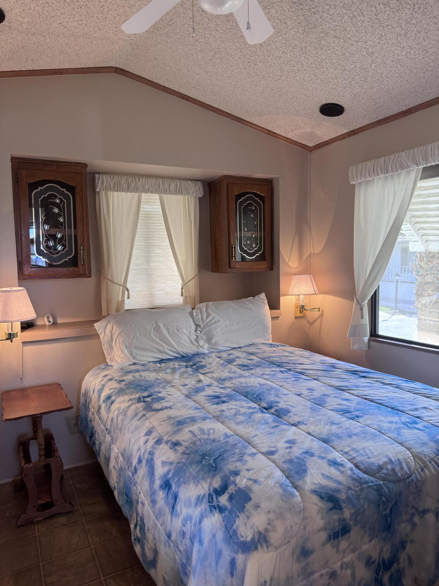 84136 Ave 44, Unit 178 Indio, CA 92203 - Photo 18 of 23 a bedroom with a bed and a window