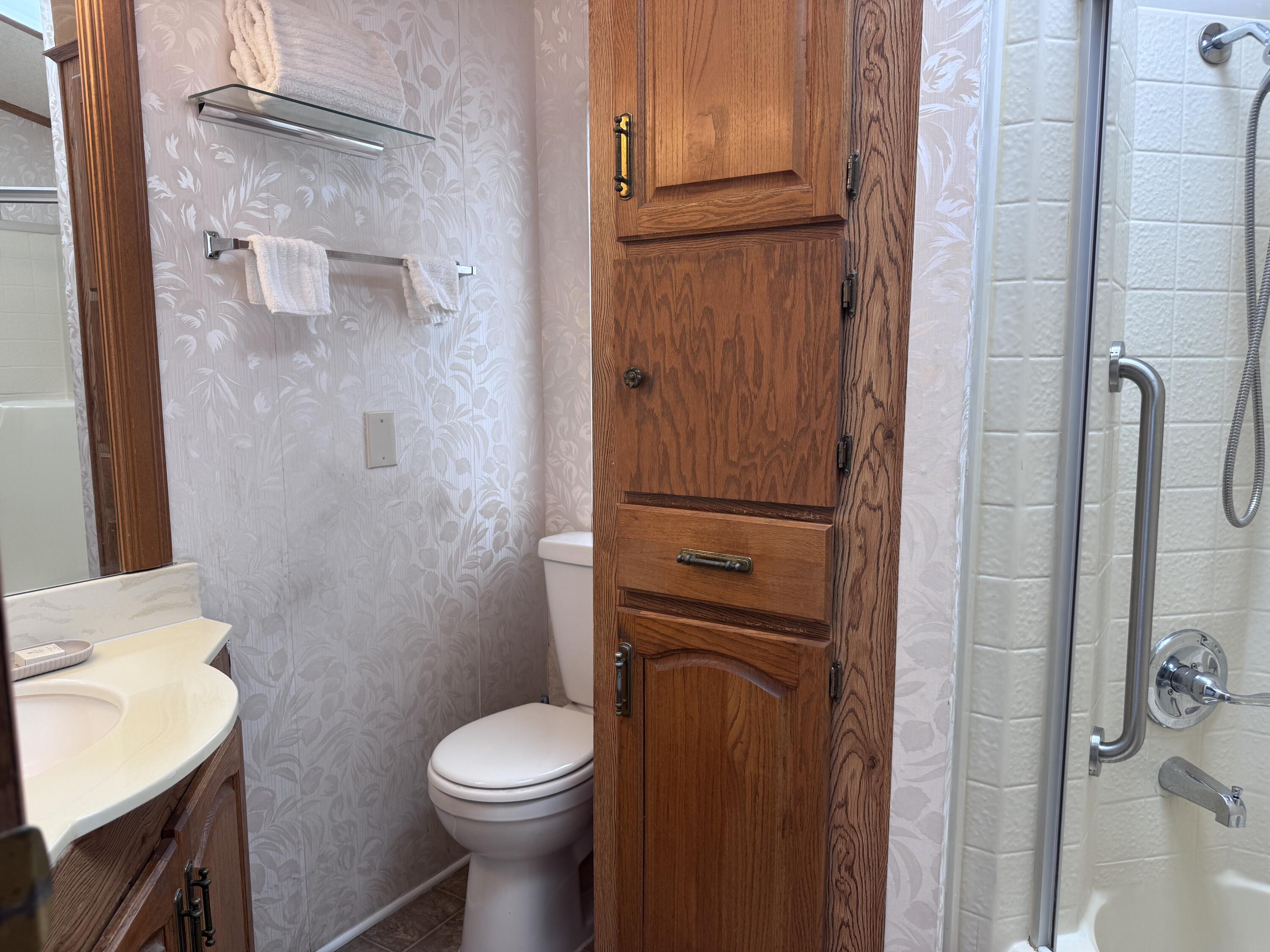 84136 Ave 44, Unit 178 Indio, CA 92203 - Photo 19 of 23 a bathroom with a toilet and a sink
