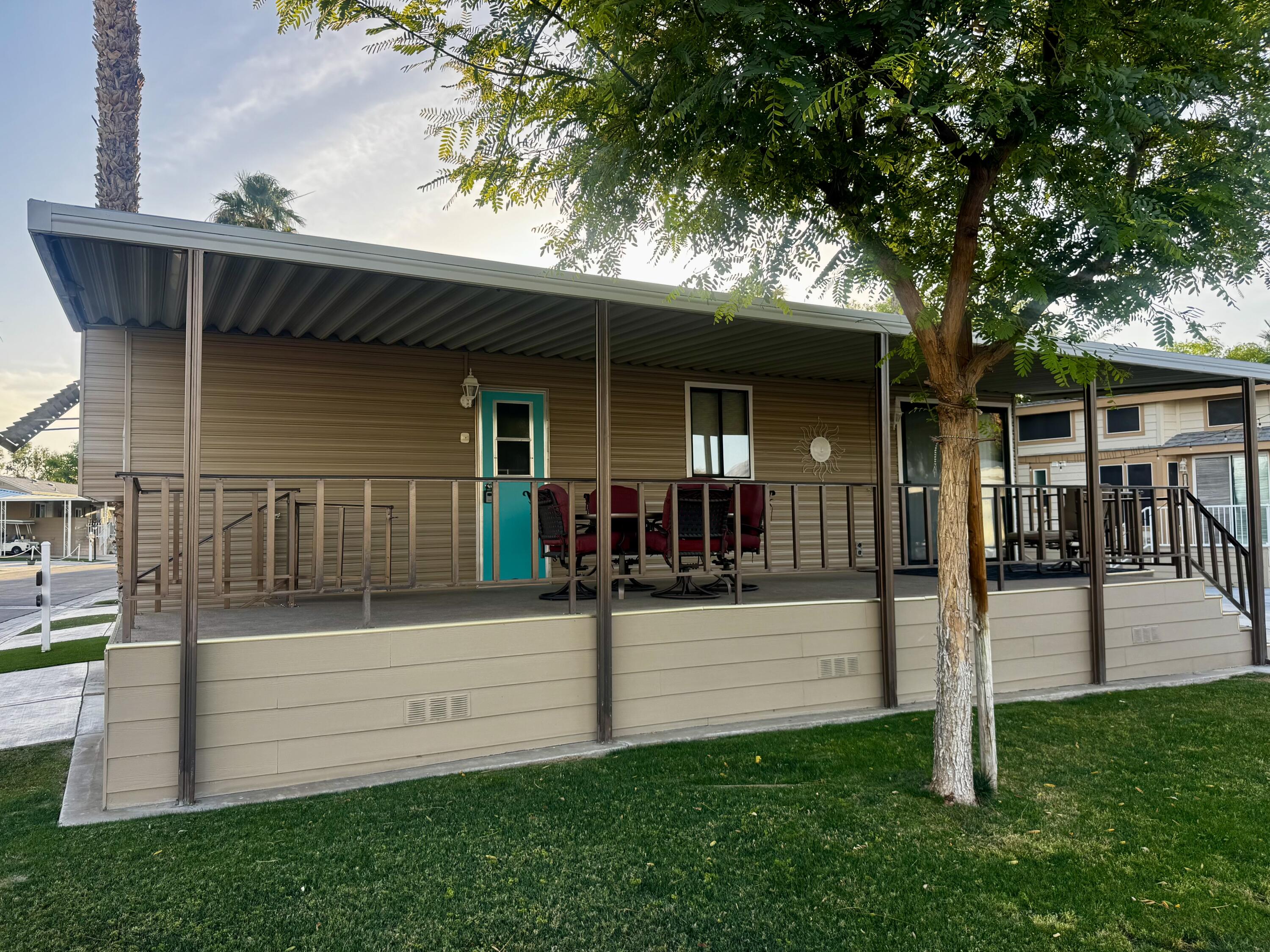 84136 Ave 44, Unit 178 Indio, CA 92203 - Photo 2 of 23 front view of a house with a yard