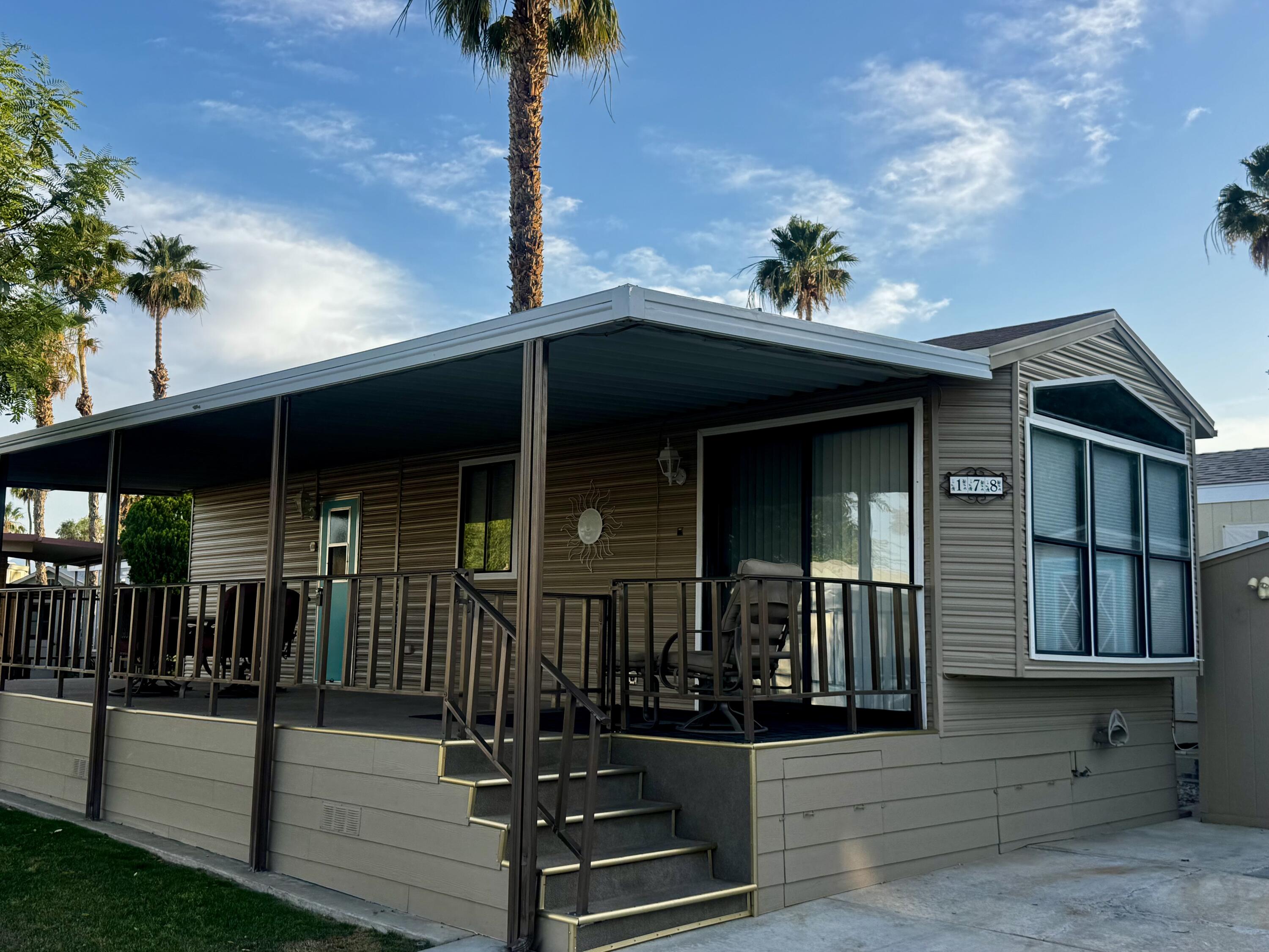 84136 Ave 44, Unit 178 Indio, CA 92203 - Photo 3 of 23 a front view of a house with stairs