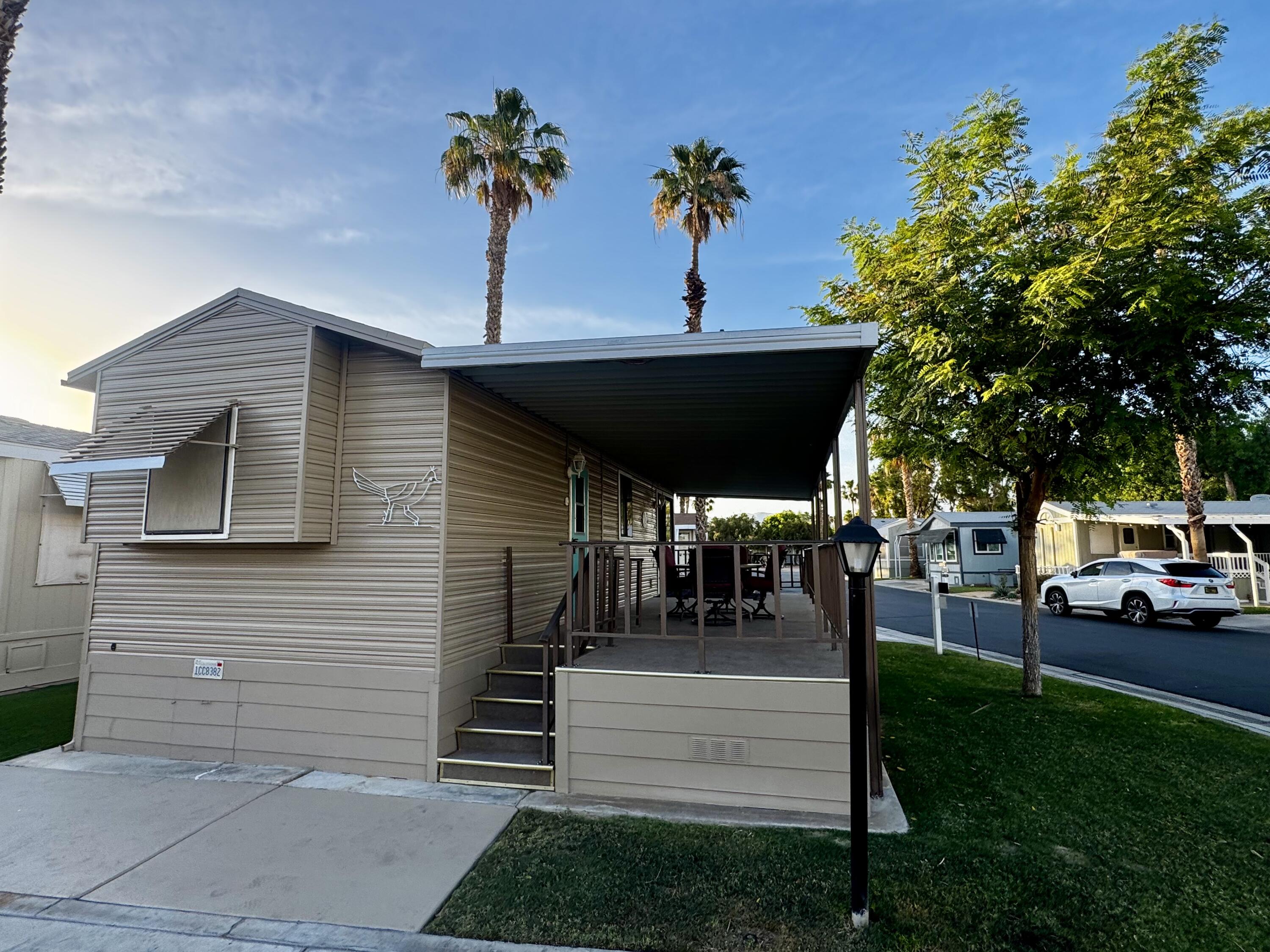 84136 Ave 44, Unit 178 Indio, CA 92203 - Photo 4 of 23 a view of outdoor space yard deck patio and fire pit