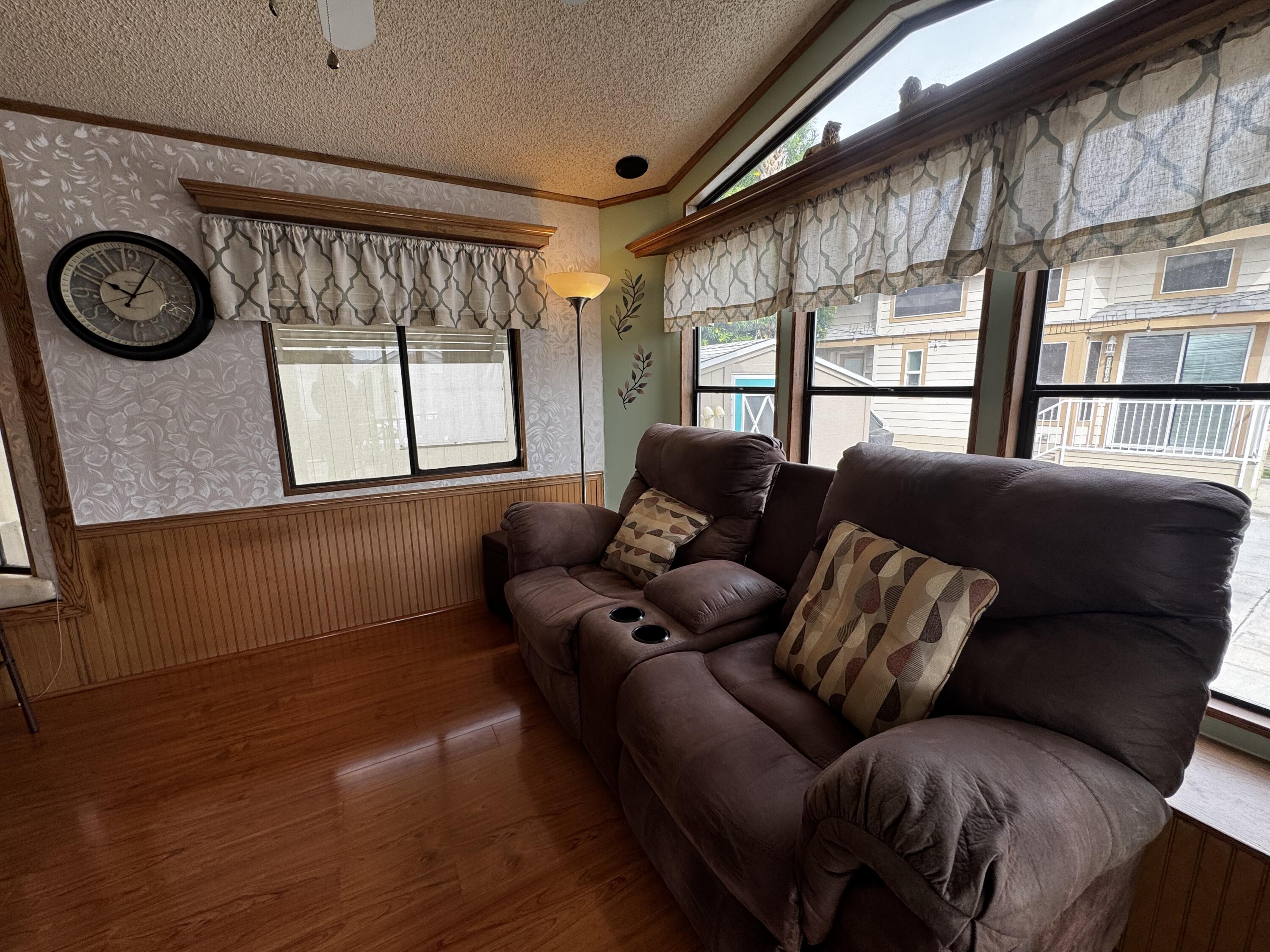 84136 Ave 44, Unit 178 Indio, CA 92203 - Photo 8 of 23 a living room with furniture and a large window