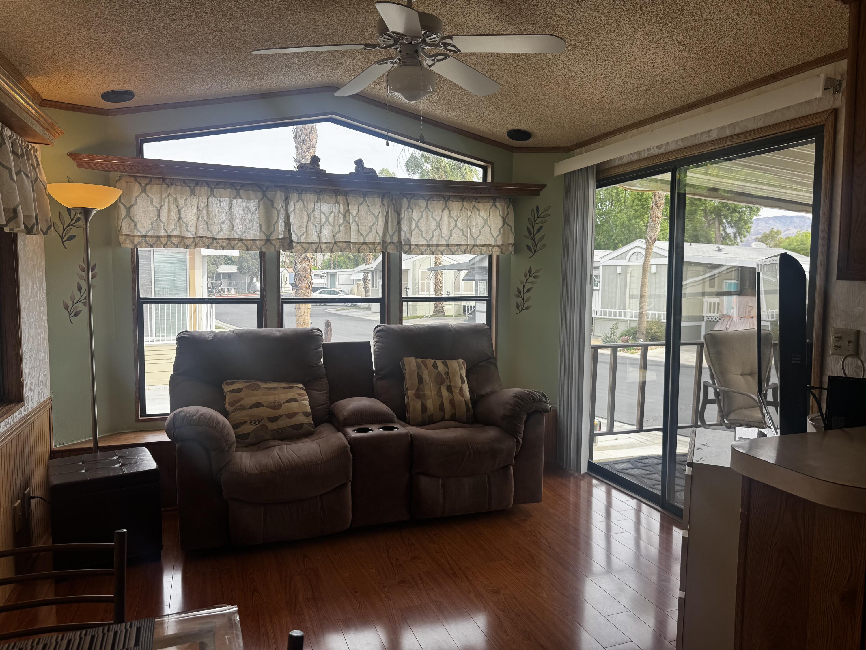 84136 Ave 44, Unit 178 Indio, CA 92203 - Photo 9 of 23 a living room with furniture and a large window
