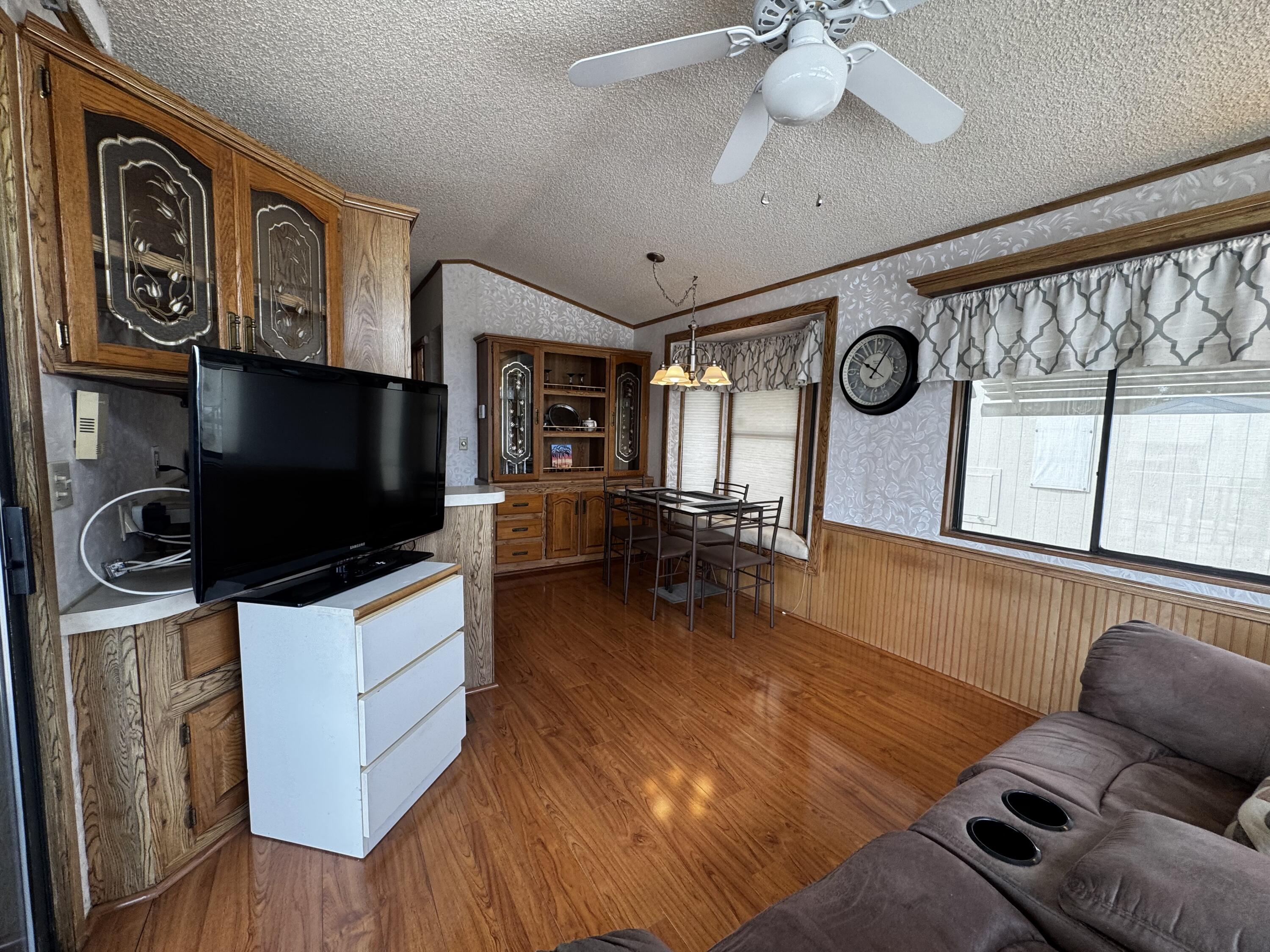 84136 Ave 44, Unit 178 Indio, CA 92203 - Photo 10 of 23 a living room with furniture and a flat screen tv