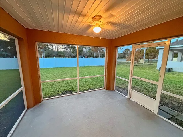 a view of an room with balcony and ocean view