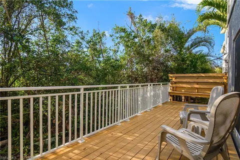 a view of a balcony with chairs