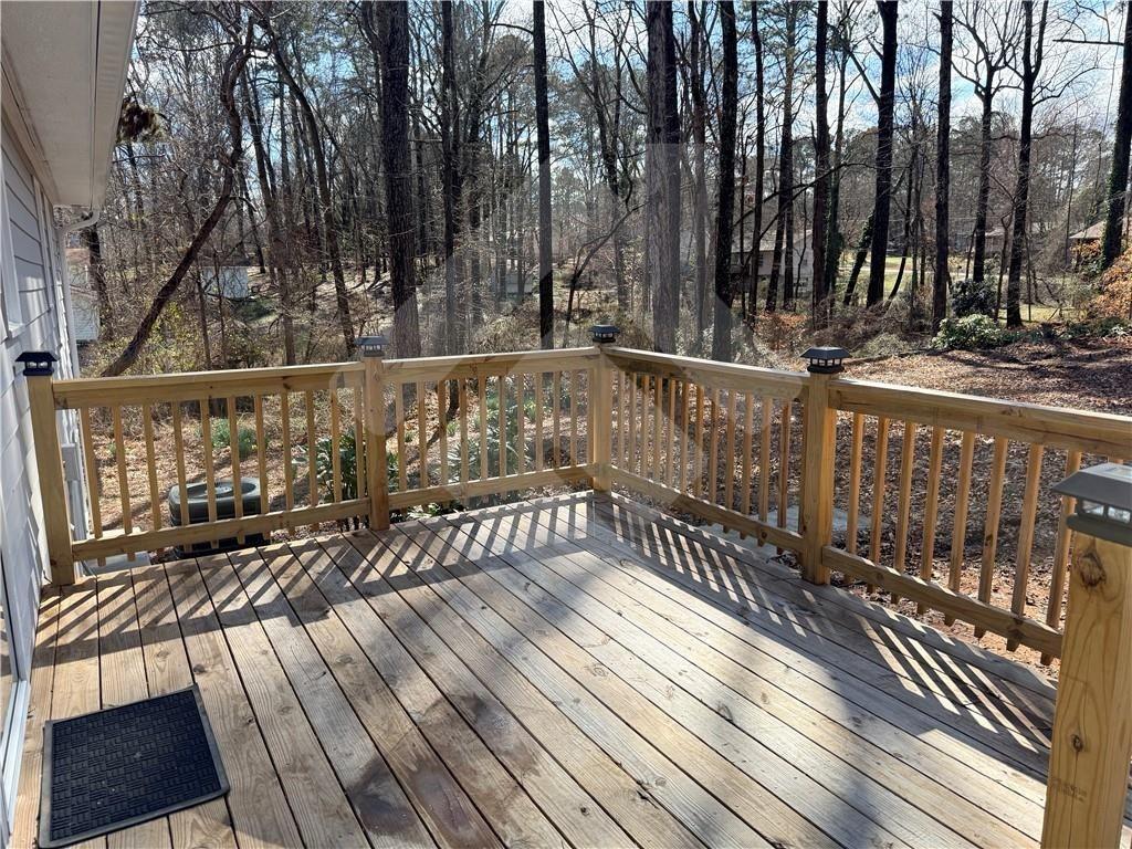 4502 Alder Lane Powder Springs, GA 30127 - Photo 13 of 64 a view of balcony with wooden floor and fence